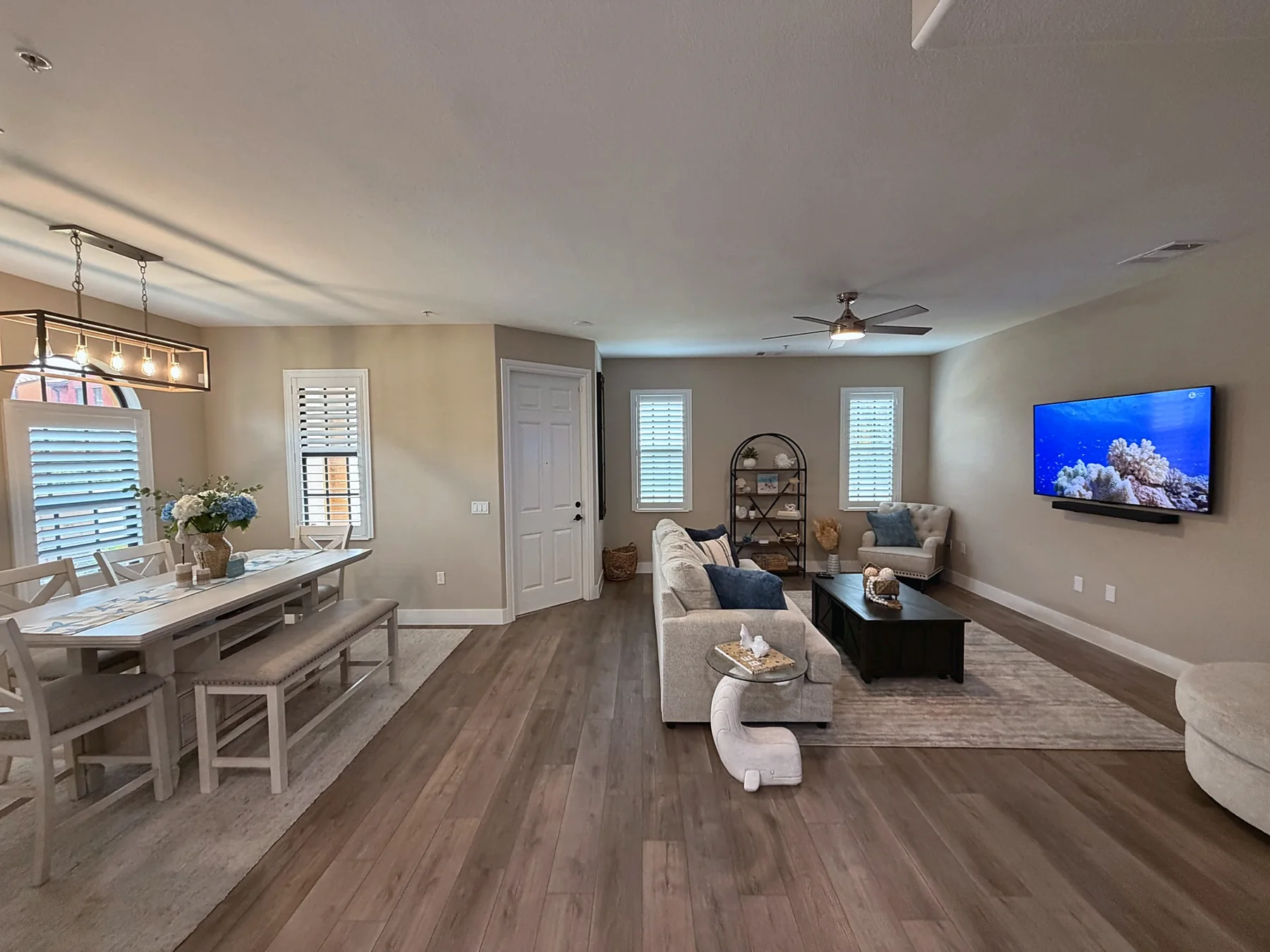 Open living and dining room with arched windows